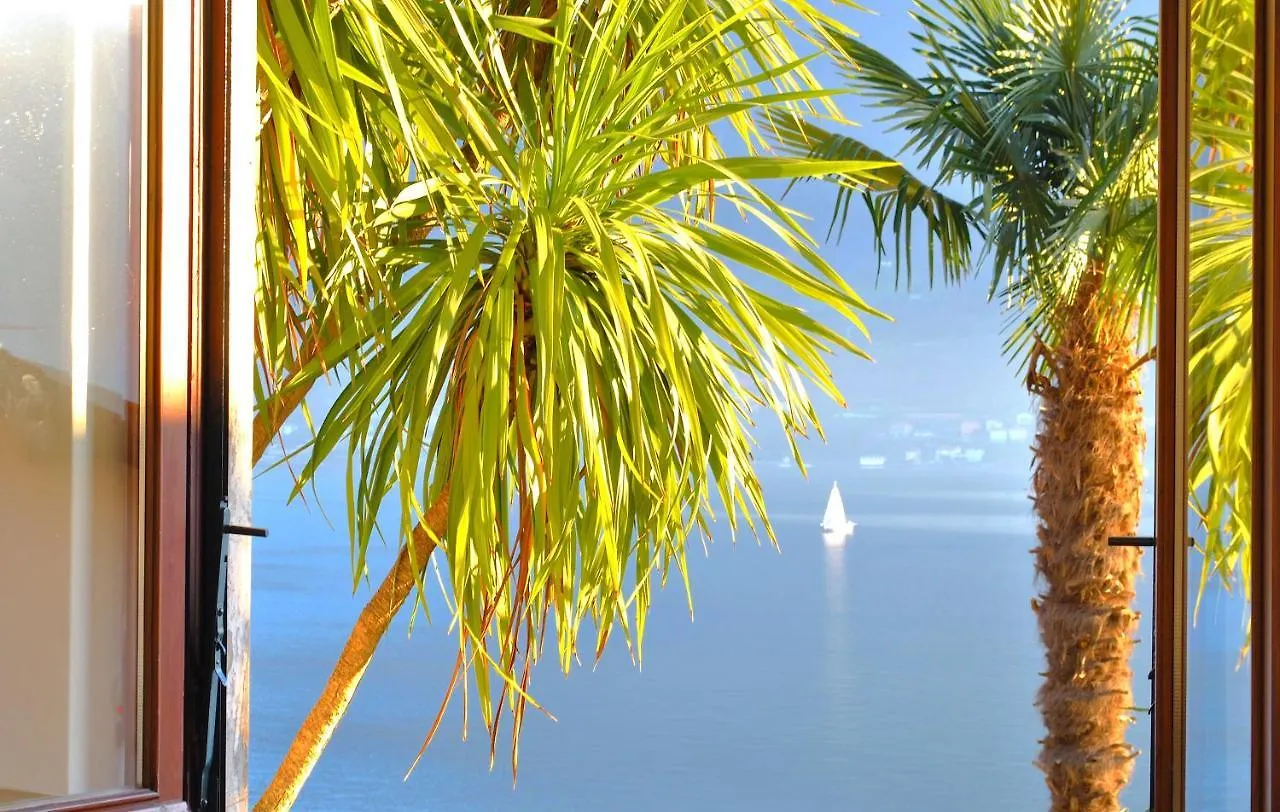 Apartment The Palm With Garden Sala Comacina